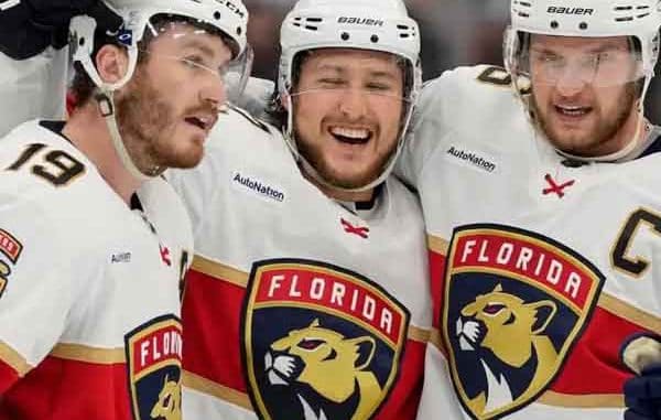 three Florida Panthers players celebrating