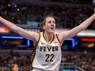 Caitlin Clark of the Indiana Fever with her arms up