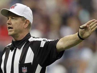 Super Bowl LIX ref Carl Cheffers signaling a first down