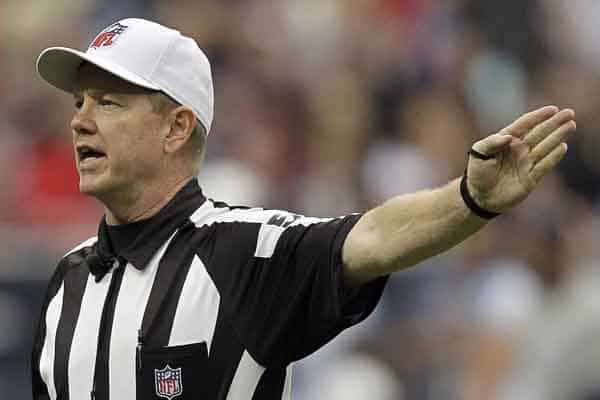 Super Bowl LIX ref Carl Cheffers signaling a first down