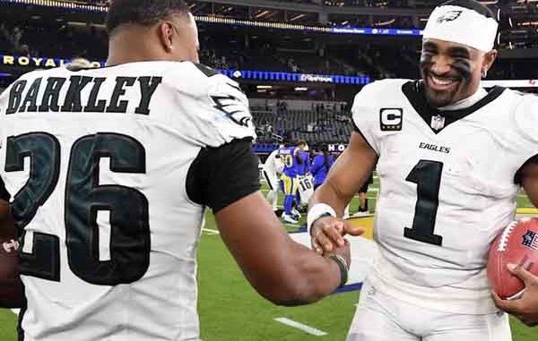 Jalen Hurts shaking hands with Saquon Barkley