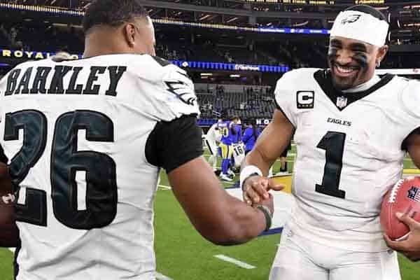 Jalen Hurts shaking hands with Saquon Barkley