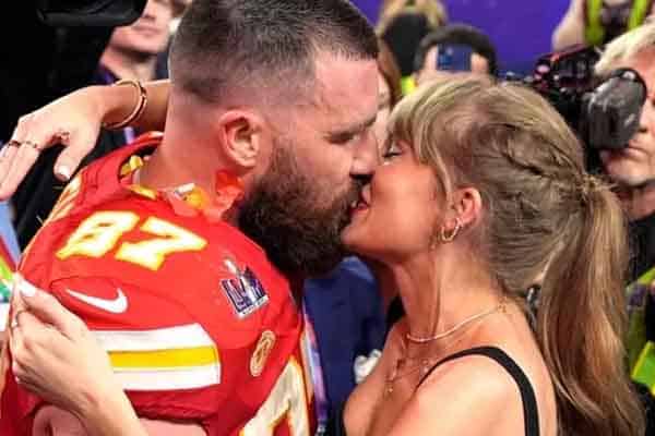 Taylor Swift and Travis Kelce kissing after the Super Bowl