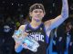 Mac McClung holding a trophy and waving to the crowd